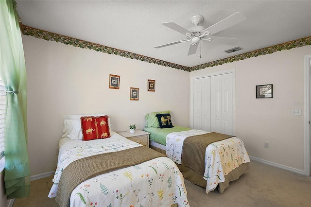 2290 Due W Dr, The Villages, FL 32162 - carpeted bedroom featuring a closet, baseboards, a ceiling fan, and visible vents
