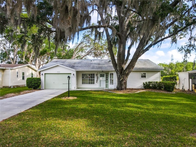 ranch-style home with a front yard, driveway, and a garage