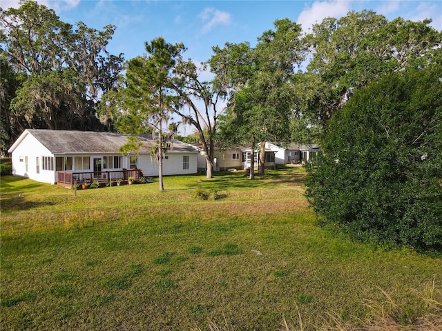 view of yard with a deck
