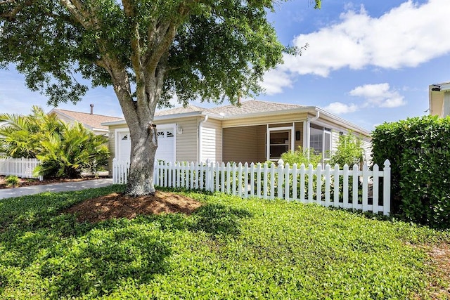 1667 Osprey Ave, The Villages, FL 32162 - view of front of property featuring a fenced front yard, driveway, and a garage