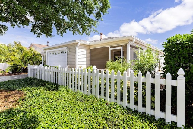 1667 Osprey Ave, The Villages, FL 32162 - ranch-style house with a fenced front yard and a garage
