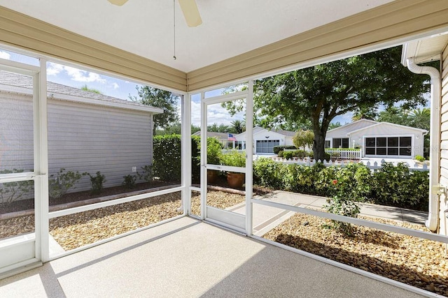 1667 Osprey Ave, The Villages, FL 32162 - unfurnished sunroom featuring a ceiling fan