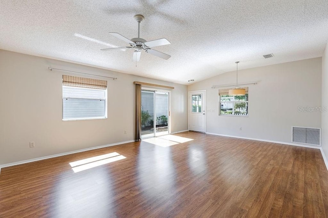 1667 Osprey Ave, The Villages, FL 32162 - spare room with wood finished floors, lofted ceiling, ceiling fan, and visible vents