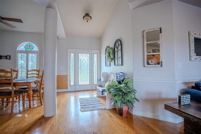 15141 Farm Rd, Groveland, FL 34736 - entrance foyer with ceiling fan, wood finished floors, vaulted ceiling, and wainscoting