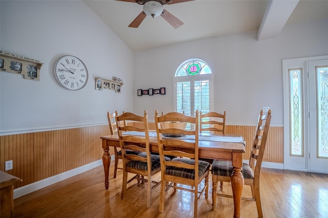 15141 Farm Rd, Groveland, FL 34736 - dining area with a wainscoted wall, vaulted ceiling, light wood finished floors, and ceiling fan