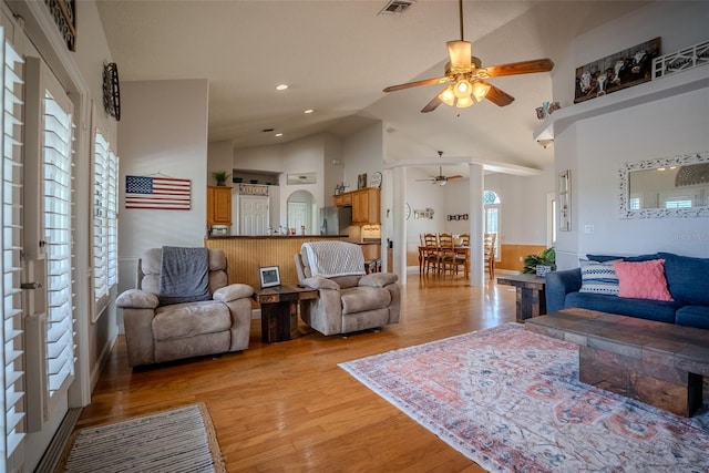 15141 Farm Rd, Groveland, FL 34736 - living area featuring light wood-type flooring, recessed lighting, high vaulted ceiling, visible vents, and ceiling fan