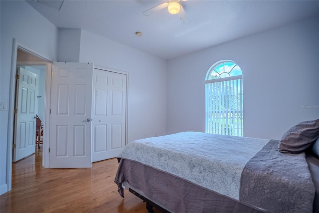 15141 Farm Rd, Groveland, FL 34736 - bedroom with a closet, wood finished floors, and a ceiling fan