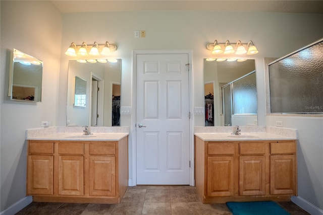15141 Farm Rd, Groveland, FL 34736 - bathroom with a stall shower, a spacious closet, a sink, and two vanities