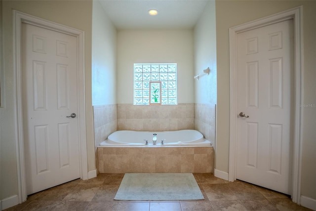 15141 Farm Rd, Groveland, FL 34736 - full bathroom featuring tile patterned floors and a garden tub