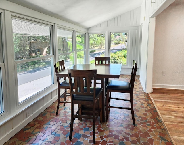 dining room featuring vaulted ceiling