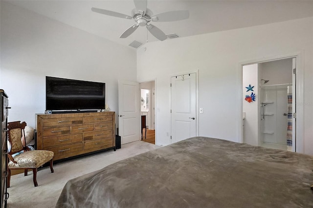 bedroom with vaulted ceiling, a ceiling fan, visible vents, and carpet