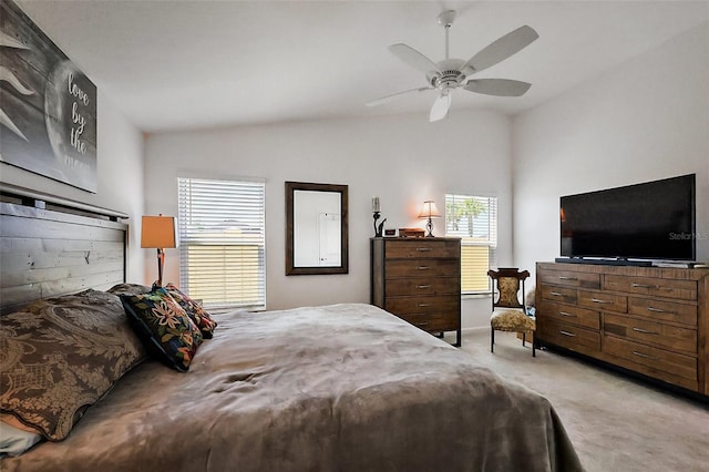 bedroom featuring light colored carpet, ceiling fan, and vaulted ceiling