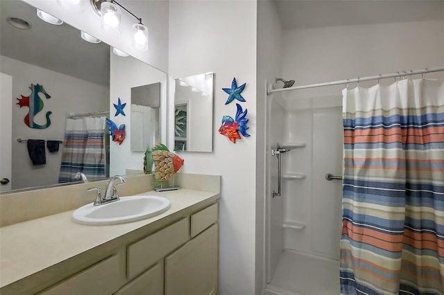full bath featuring a shower with curtain and vanity