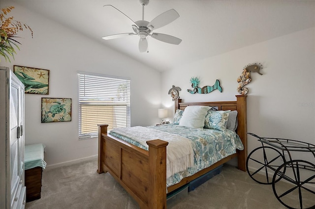 carpeted bedroom featuring vaulted ceiling, a ceiling fan, and baseboards