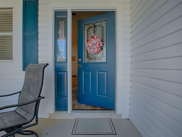 1010 Ventura Dr, The Villages, FL 32159 - doorway to property featuring covered porch