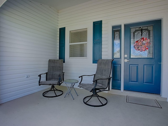 1010 Ventura Dr, The Villages, FL 32159 - view of exterior entry featuring a porch