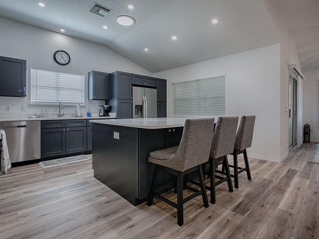 1010 Ventura Dr, The Villages, FL 32159 - kitchen featuring visible vents, a sink, light countertops, appliances with stainless steel finishes, and a kitchen island