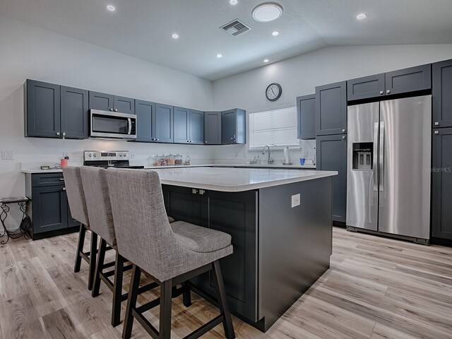 1010 Ventura Dr, The Villages, FL 32159 - kitchen with visible vents, a center island, light countertops, and stainless steel appliances