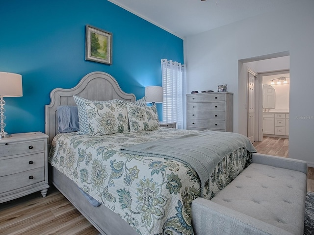 1010 Ventura Dr, The Villages, FL 32159 - bedroom with wood finished floors and ensuite bath