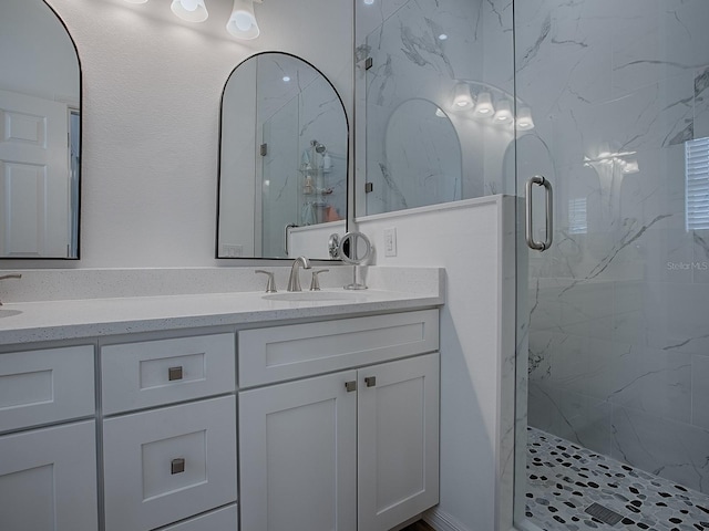 1010 Ventura Dr, The Villages, FL 32159 - bathroom featuring a sink, double vanity, and a marble finish shower