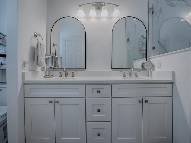 1010 Ventura Dr, The Villages, FL 32159 - bathroom with double vanity, a sink, and a marble finish shower