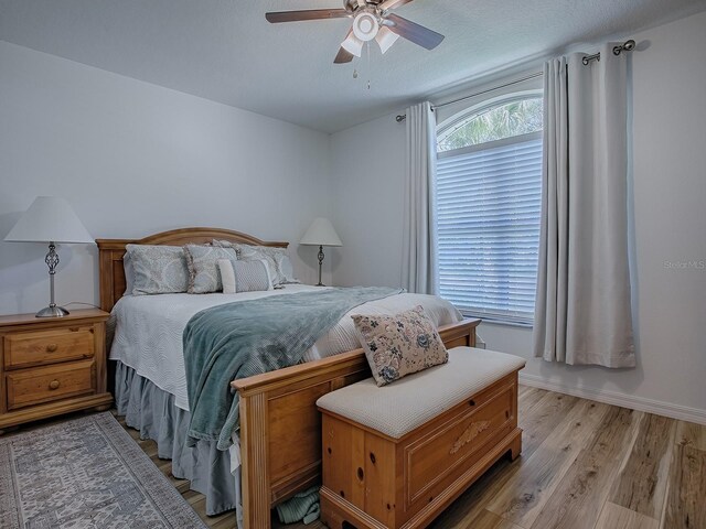 1010 Ventura Dr, The Villages, FL 32159 - bedroom featuring light wood finished floors and ceiling fan