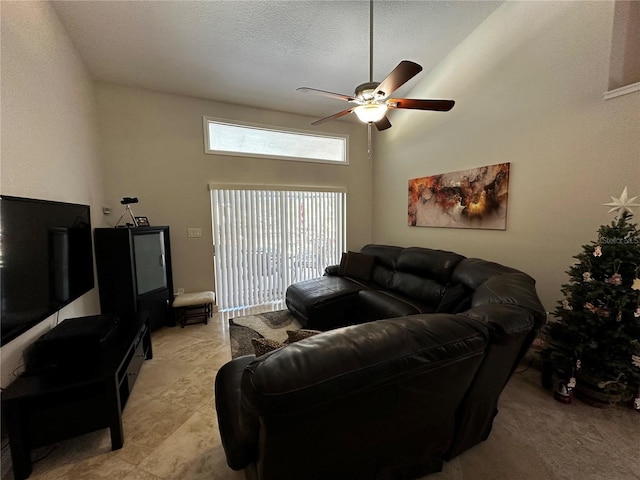 3511 Fox Lake Dr, Apopka, FL 32712 - living room featuring a ceiling fan, a high ceiling, and a textured ceiling