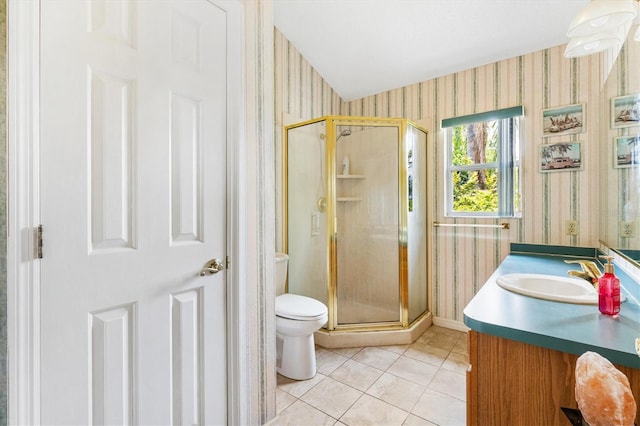 bathroom with wallpapered walls, toilet, a stall shower, vanity, and tile patterned flooring