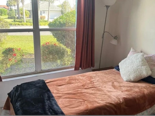 bedroom featuring multiple windows