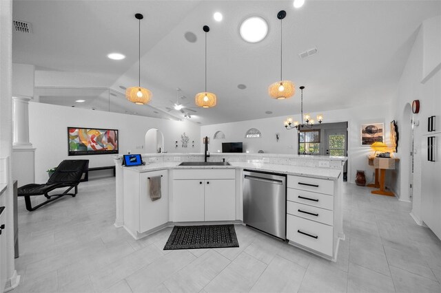 kitchen featuring stainless steel dishwasher, visible vents, a sink, lofted ceiling, and open floor plan