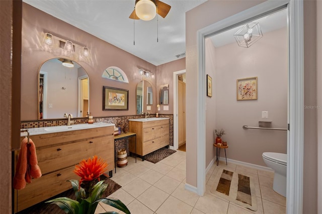 full bathroom featuring a sink, visible vents, tile patterned floors, and two vanities