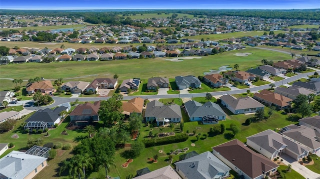drone / aerial view featuring a residential view and view of golf course