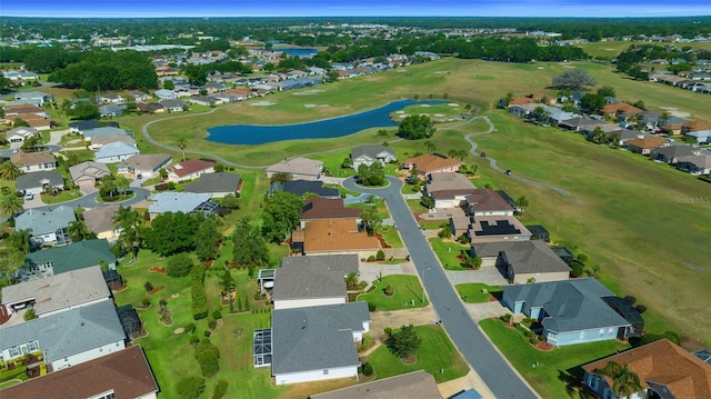 bird's eye view featuring a water view, golf course view, and a residential view