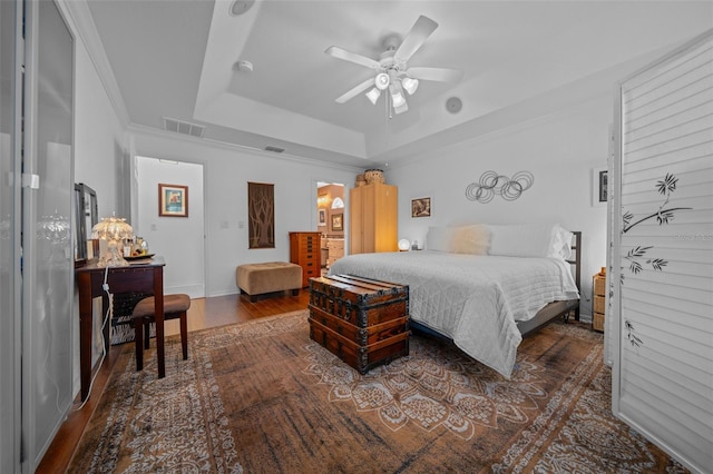 11860 SE 179th St, Summerfield, FL 34491 - bedroom featuring a raised ceiling, wood finished floors, ceiling fan, and baseboards