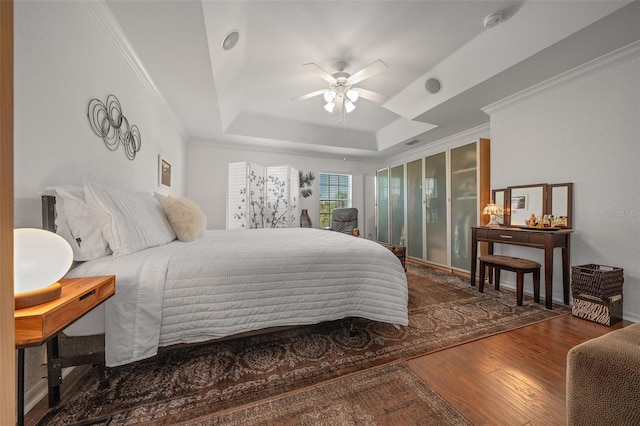 11860 SE 179th St, Summerfield, FL 34491 - bedroom with wood finished floors, a raised ceiling, ornamental molding, and a ceiling fan