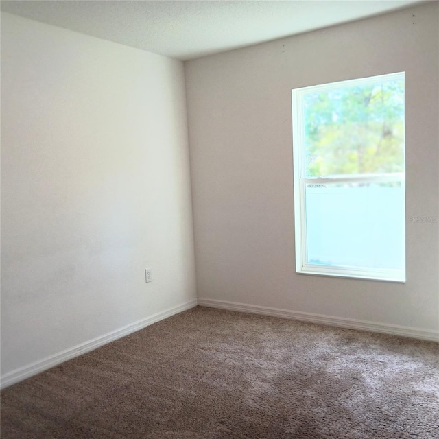 27 Perch Dr, Kissimmee, FL 34759 - carpeted spare room featuring baseboards
