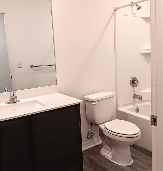 27 Perch Dr, Kissimmee, FL 34759 - full bath with vanity, toilet, shower / bath combination, and wood finished floors