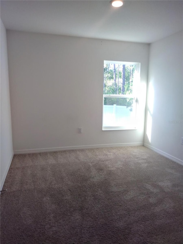 27 Perch Dr, Kissimmee, FL 34759 - carpeted spare room with baseboards and recessed lighting