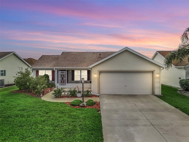 1307 Galindo Pl, The Villages, FL 32159 - ranch-style house with a garage, central AC, a yard, a shingled roof, and concrete driveway