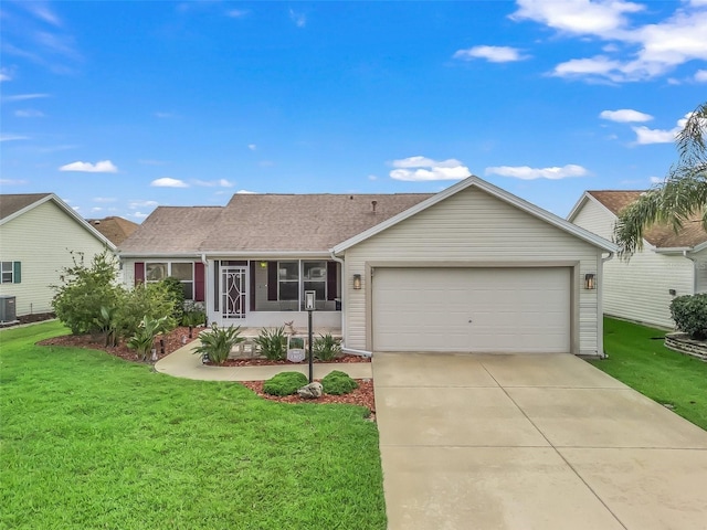 1307 Galindo Pl, The Villages, FL 32159 - ranch-style home with central air condition unit, a garage, driveway, and a front lawn