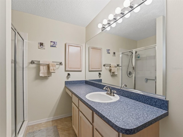 1307 Galindo Pl, The Villages, FL 32159 - full bathroom featuring tile patterned floors, a textured ceiling, baseboards, and a stall shower