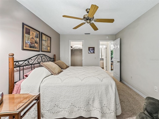 1307 Galindo Pl, The Villages, FL 32159 - bedroom with baseboards, a spacious closet, carpet floors, visible vents, and ceiling fan