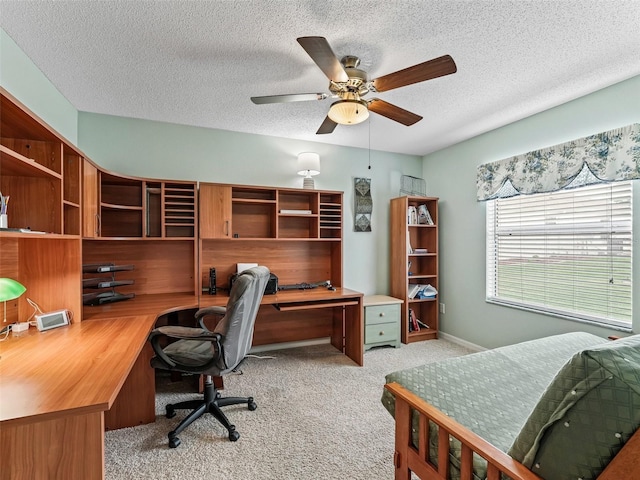1307 Galindo Pl, The Villages, FL 32159 - carpeted office with baseboards, a textured ceiling, and a ceiling fan