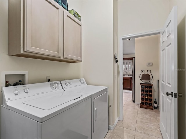 1307 Galindo Pl, The Villages, FL 32159 - clothes washing area with baseboards, a sink, cabinet space, and washer and clothes dryer