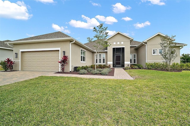 ranch-style house featuring driveway, stucco siding, an attached garage, and a front lawn