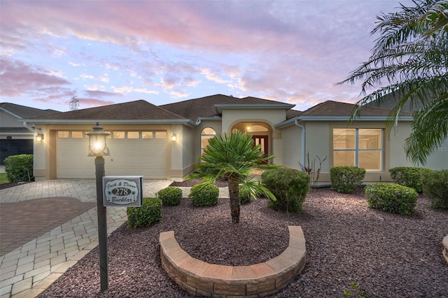 278 Matisse Ave, The Villages, FL 32162 - view of front of property featuring driveway, stucco siding, and an attached garage