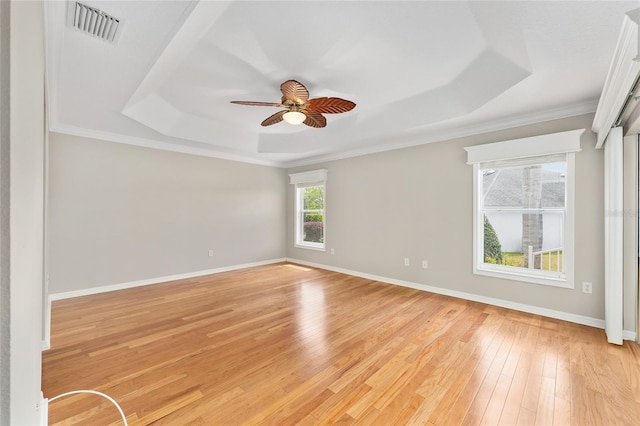 278 Matisse Ave, The Villages, FL 32162 - spare room with a tray ceiling, light wood finished floors, baseboards, and visible vents