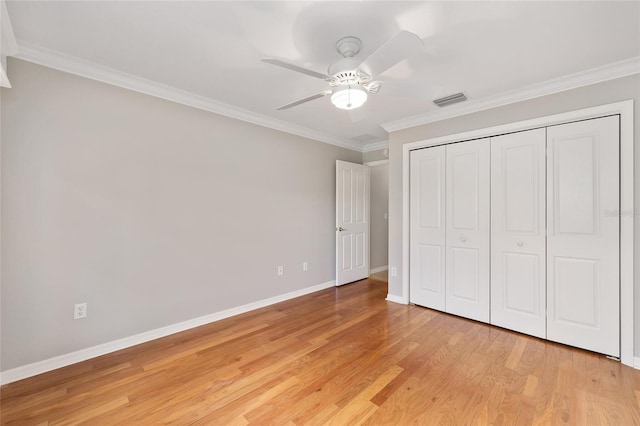 278 Matisse Ave, The Villages, FL 32162 - unfurnished bedroom featuring light wood-style floors, crown molding, a closet, visible vents, and baseboards