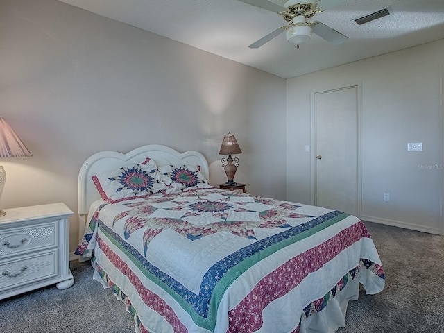 bedroom with carpet floors, a ceiling fan, visible vents, and baseboards