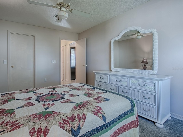 bedroom with carpet floors, a textured ceiling, and a ceiling fan